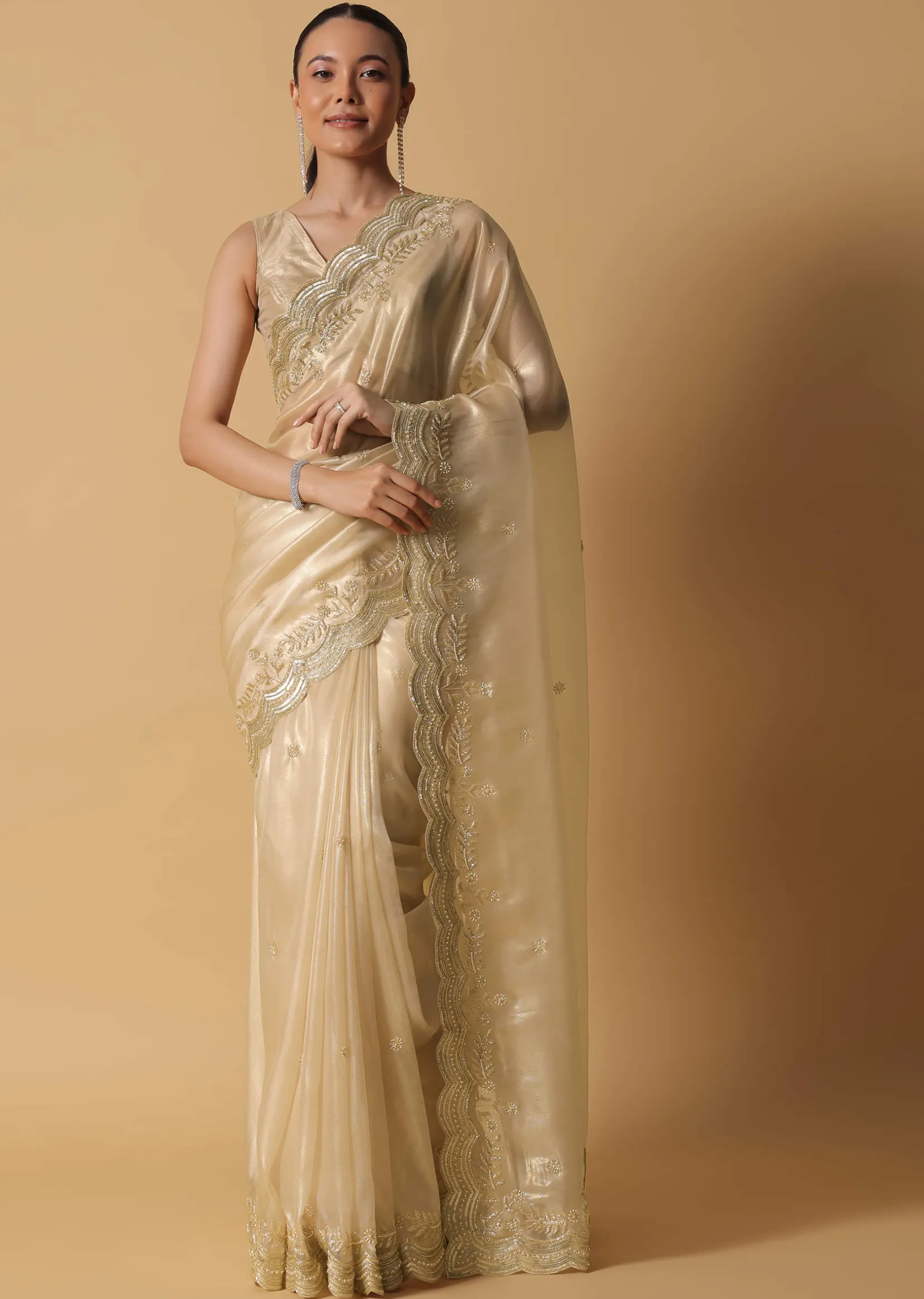 Gold Toned Foil Saree Fabricated In Tissue With Cut Dana Embellished Borders