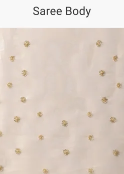 Gold Toned Foil Saree Fabricated In Tissue With Cut Dana Embellished Borders
