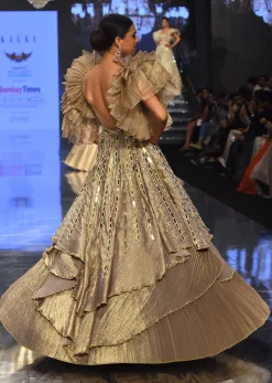 Gold Toned Kalki Gown With Ruffle Sleeves And Embroidery - NOOR 2022