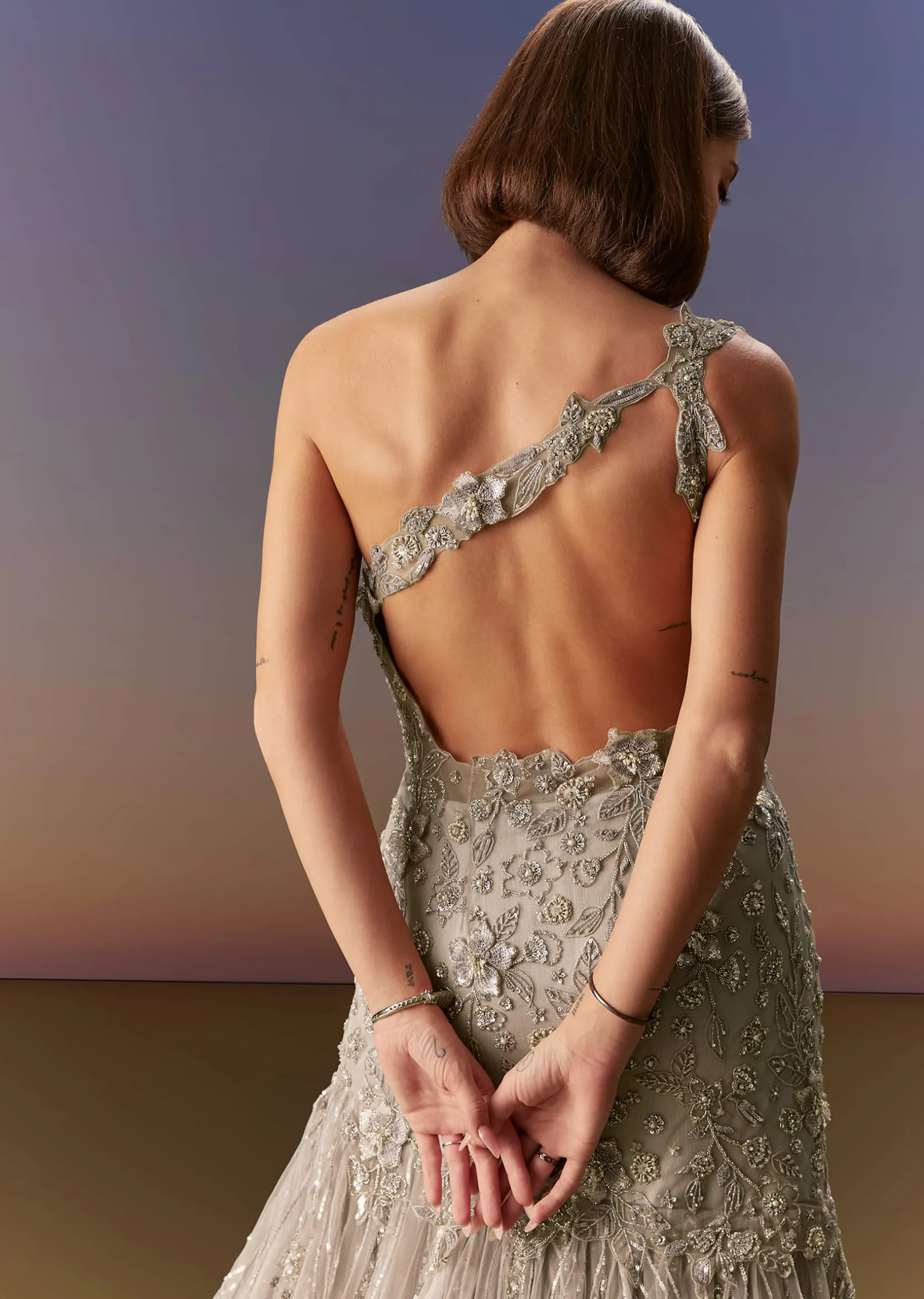 Grey Backless Gown With One Shoulder Bodice And Sculpted Fit
