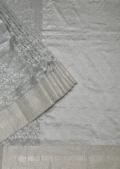 Grey South Silk Saree With Abstract Zari Border And Unstitched Blouse Fabric