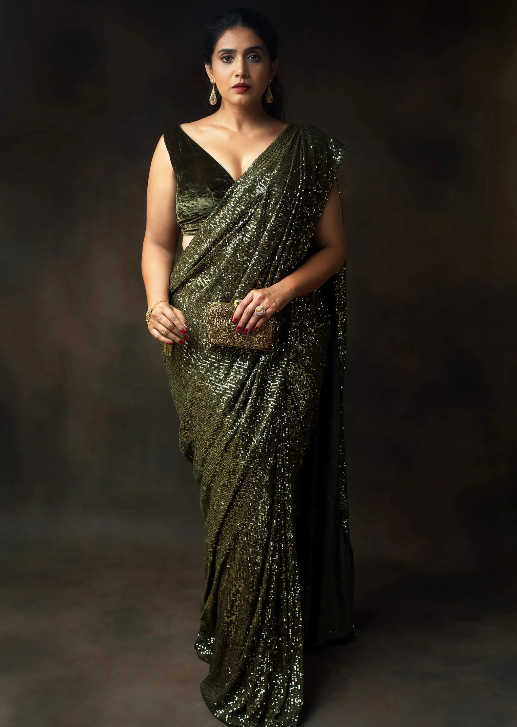 Henna Green Ready Pleated Saree Embellished In Sequins With A Matching Velvet Blouse With Plunging Neckline