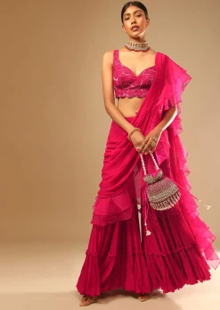 Hot Pink Crop Top Sharara Suit With An Attached Ruffle Draped And An Hand Embroidered Leaf Motifs