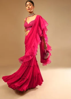 Hot Pink Crop Top Sharara Suit With An Attached Ruffle Draped And An Hand Embroidered Leaf Motifs