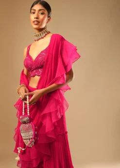 Hot Pink Crop Top Sharara Suit With An Attached Ruffle Draped And An Hand Embroidered Leaf Motifs