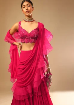 Hot Pink Crop Top Sharara Suit With An Attached Ruffle Draped And An Hand Embroidered Leaf Motifs