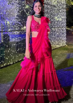 Hot Pink Crop Top Sharara Suit With An Attached Ruffle Draped And An Hand Embroidered Leaf Motifs