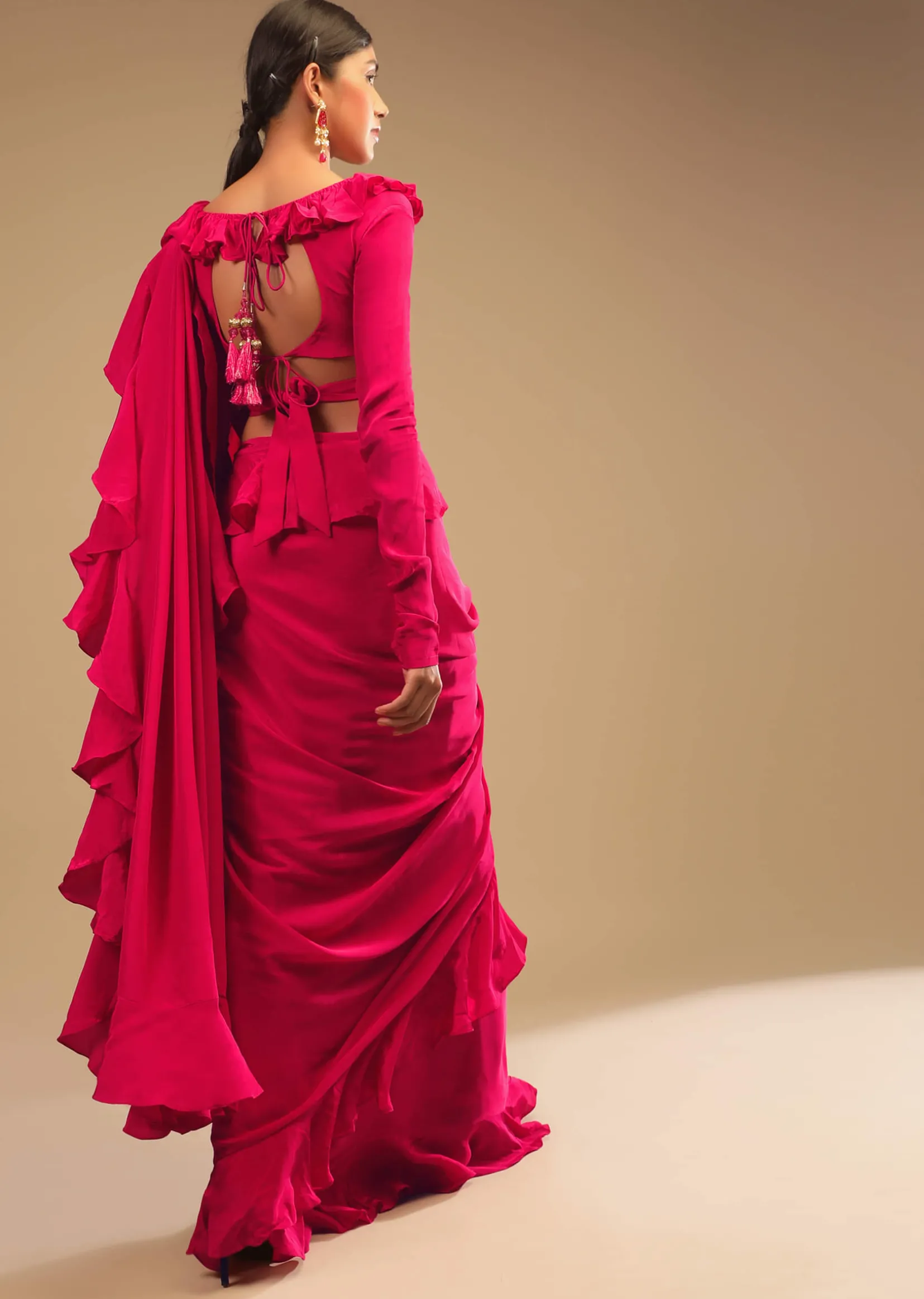 Hot Pink Saree With Ruffle Pallu, Stone Embellished Belt And A Ruffle Blouse With Side Cut Outs