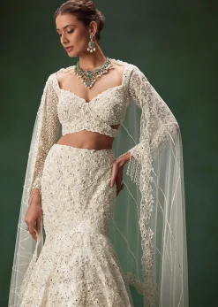 Ivory Mermaid Bridal Lehenga With Full Sleeves And Heavy Embroidery