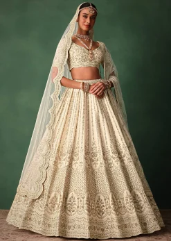 Ivory Raw Silk Hand Embroidered Lehenga Set In Cutdana Work