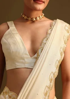 Ivory Tissue Saree With Cutdana Embroidered Border and Unstitched Blouse
