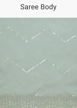 Light Blue Glass Tissue Saree With Stone Embroidery And Scallop Border