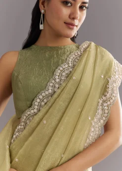 Light Green Glossy Crushed Tissue Saree With Cutdana Sequins Embroidery And Scallop Border