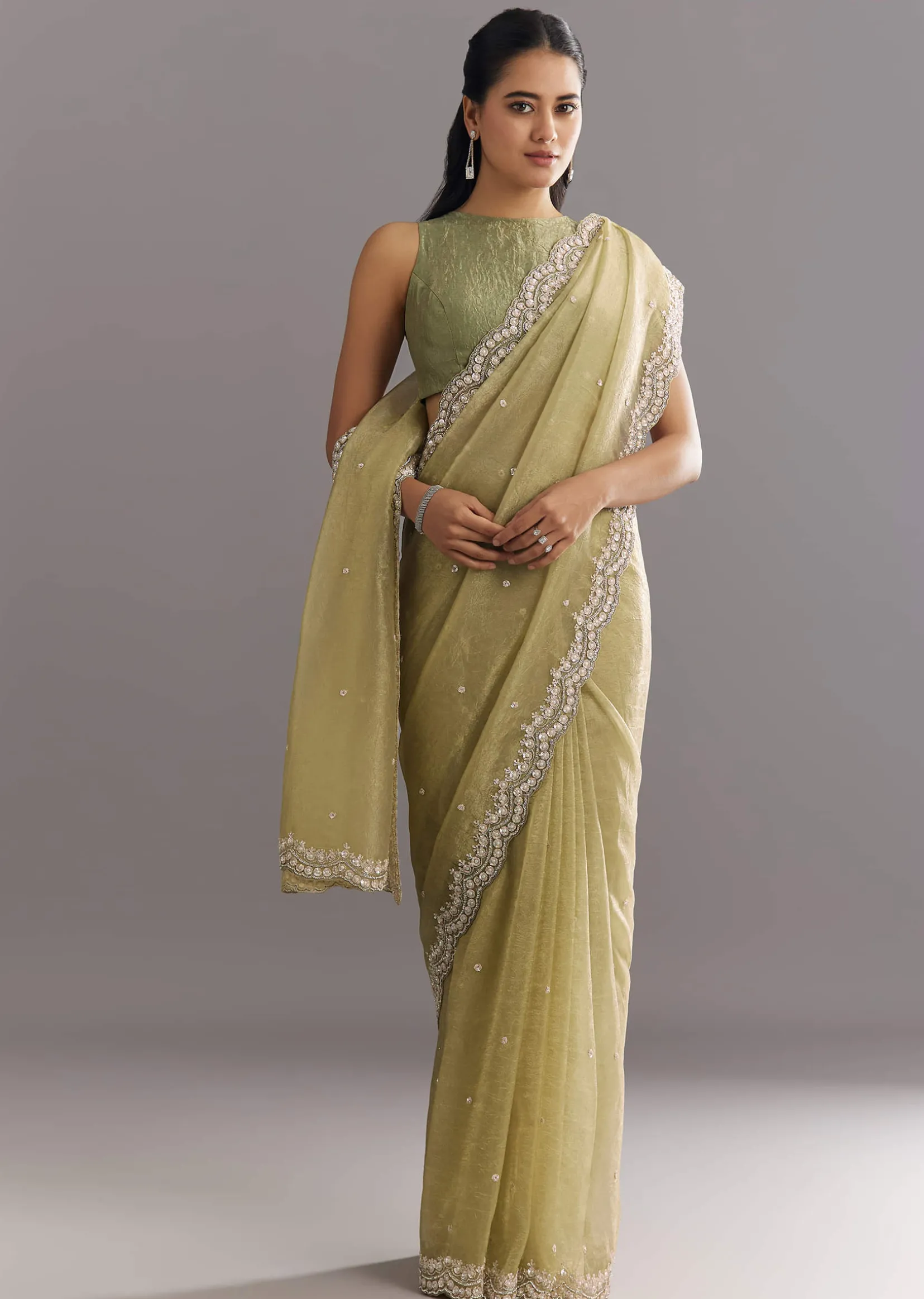 Light Green Glossy Crushed Tissue Saree With Cutdana Sequins Embroidery And Scallop Border