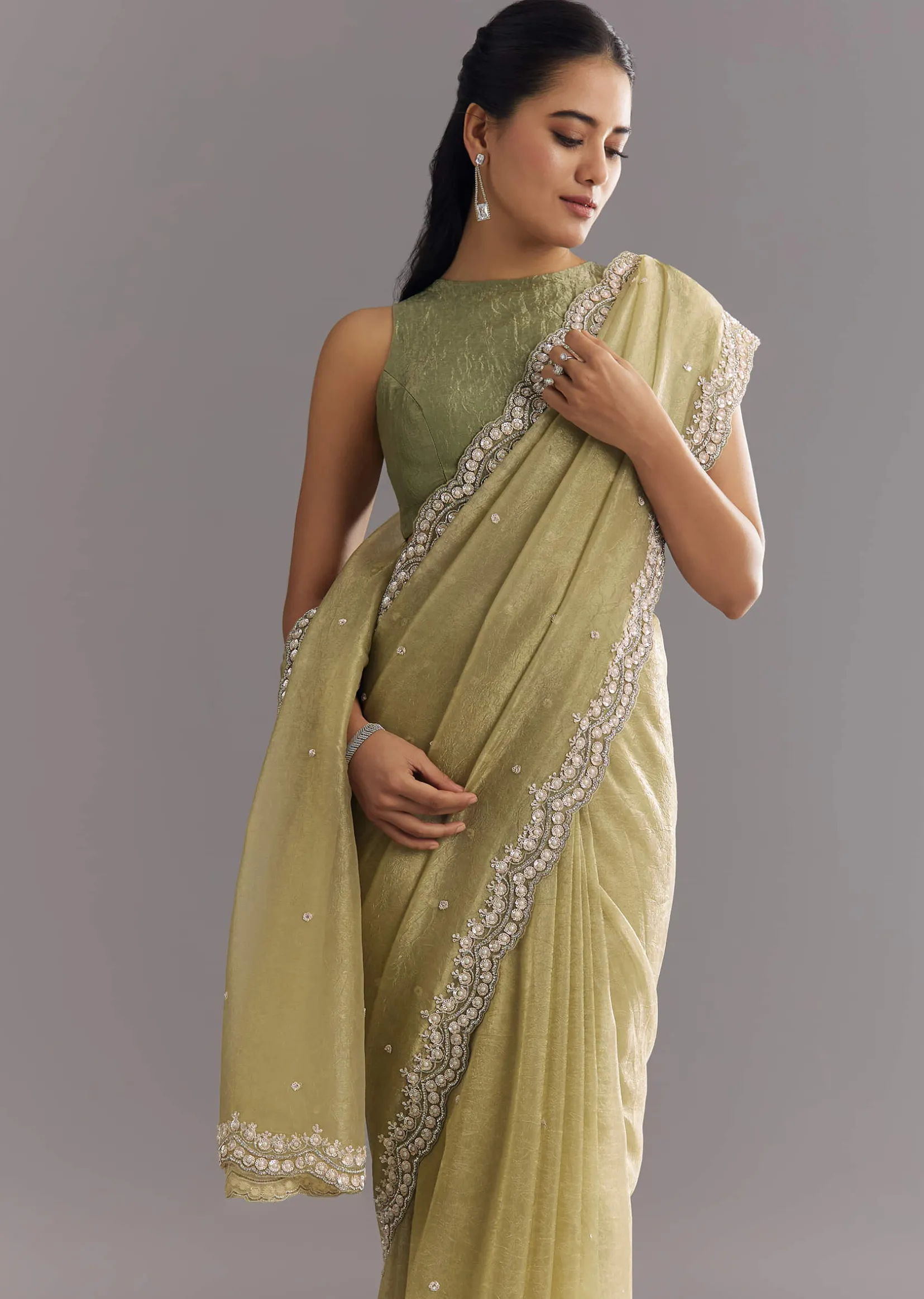 Light Green Glossy Crushed Tissue Saree With Cutdana Sequins Embroidery And Scallop Border