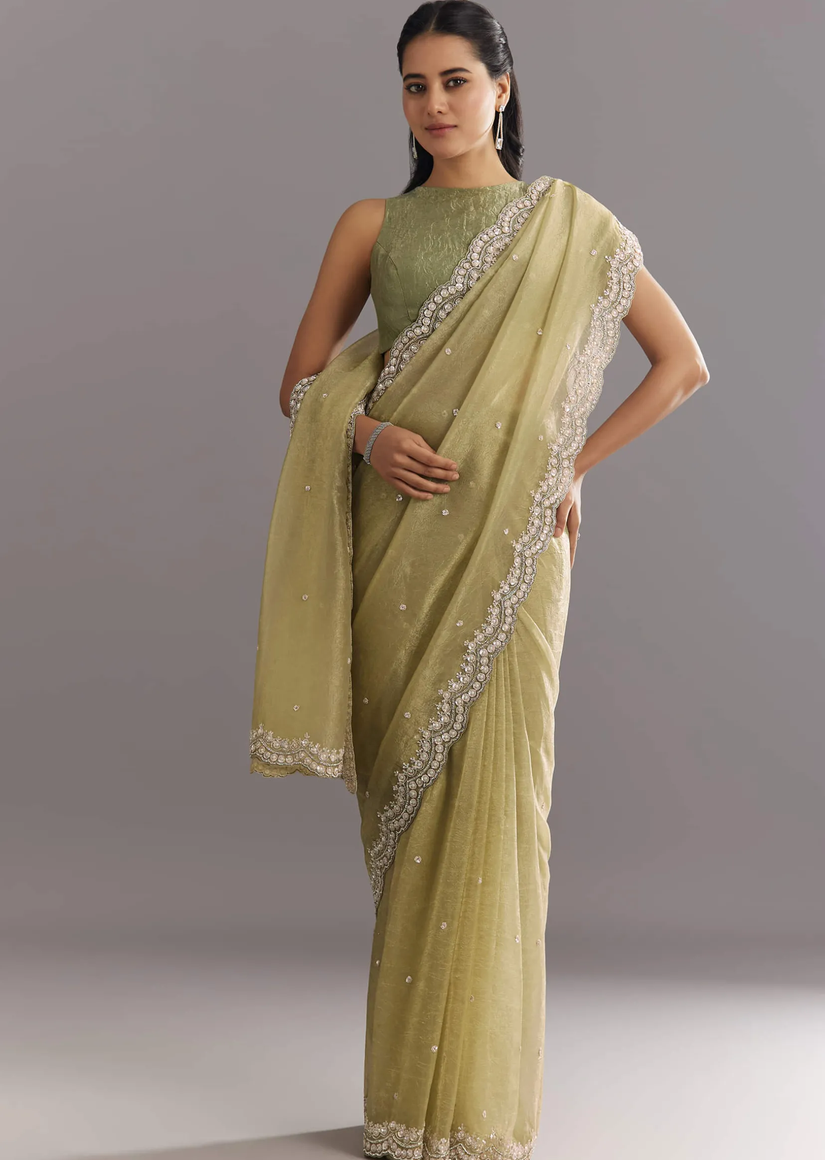 Light Green Glossy Crushed Tissue Saree With Cutdana Sequins Embroidery And Scallop Border