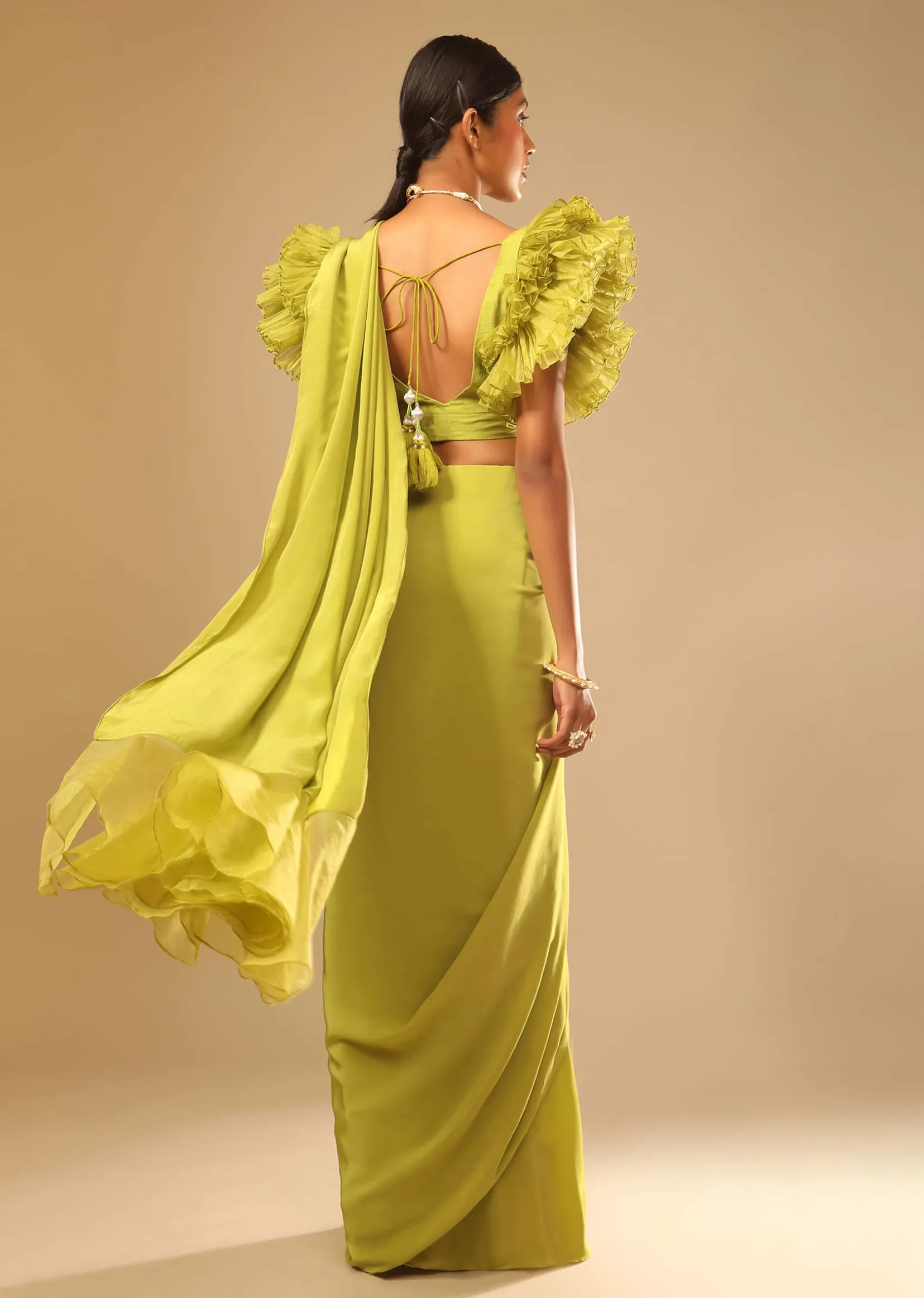 Lime Green Saree In Crepe With Elaborate Ruffle Sleeved Crop Top And Heavy Stone Embroidered Belt