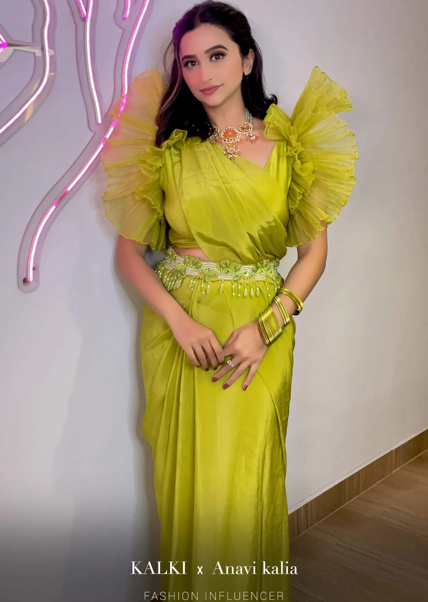 Lime Green Saree In Crepe With Elaborate Ruffle Sleeved Crop Top And Heavy Stone Embroidered Belt