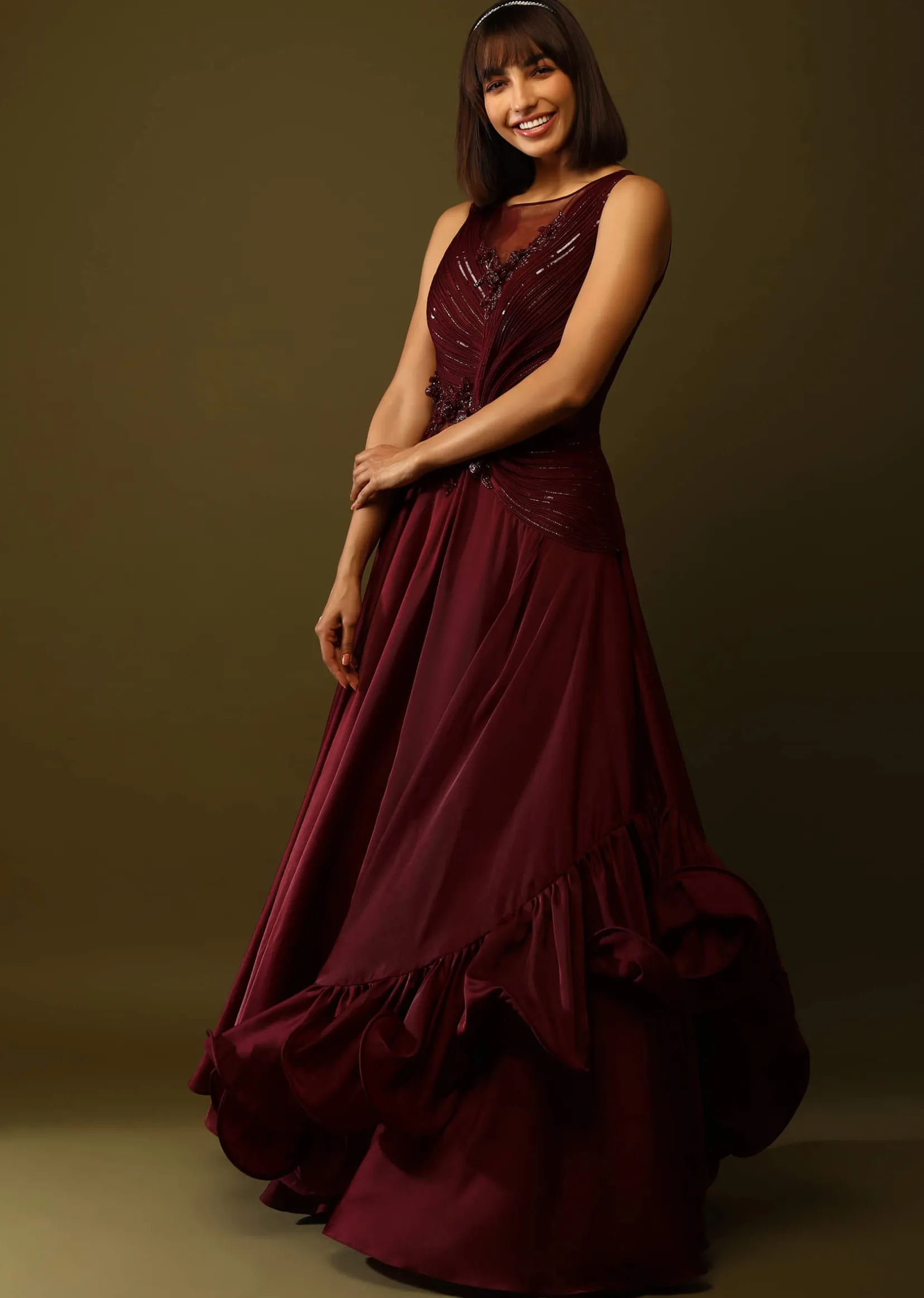 Maroon Gown With Ruched Bodice And Fancy Ruffled Hem