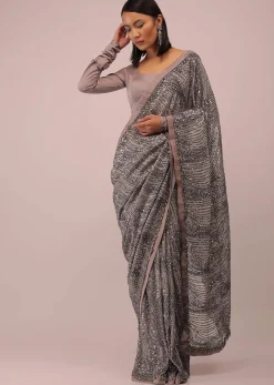 Mauve Purple Satin Saree In Sequins Embroidery With A Crop Top In Full Sleeves And A Round Neckline