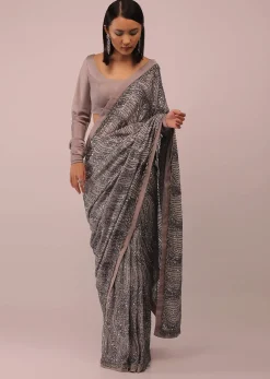 Mauve Purple Satin Saree In Sequins Embroidery With A Crop Top In Full Sleeves And A Round Neckline