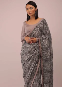 Mauve Purple Satin Saree In Sequins Embroidery With A Crop Top In Full Sleeves And A Round Neckline