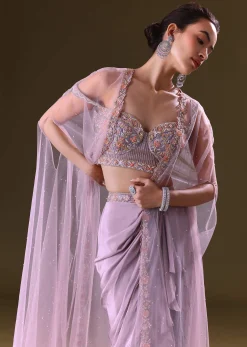 Mauve Ruffled Drape Skirt With Embroidered Blouse And Net Cape