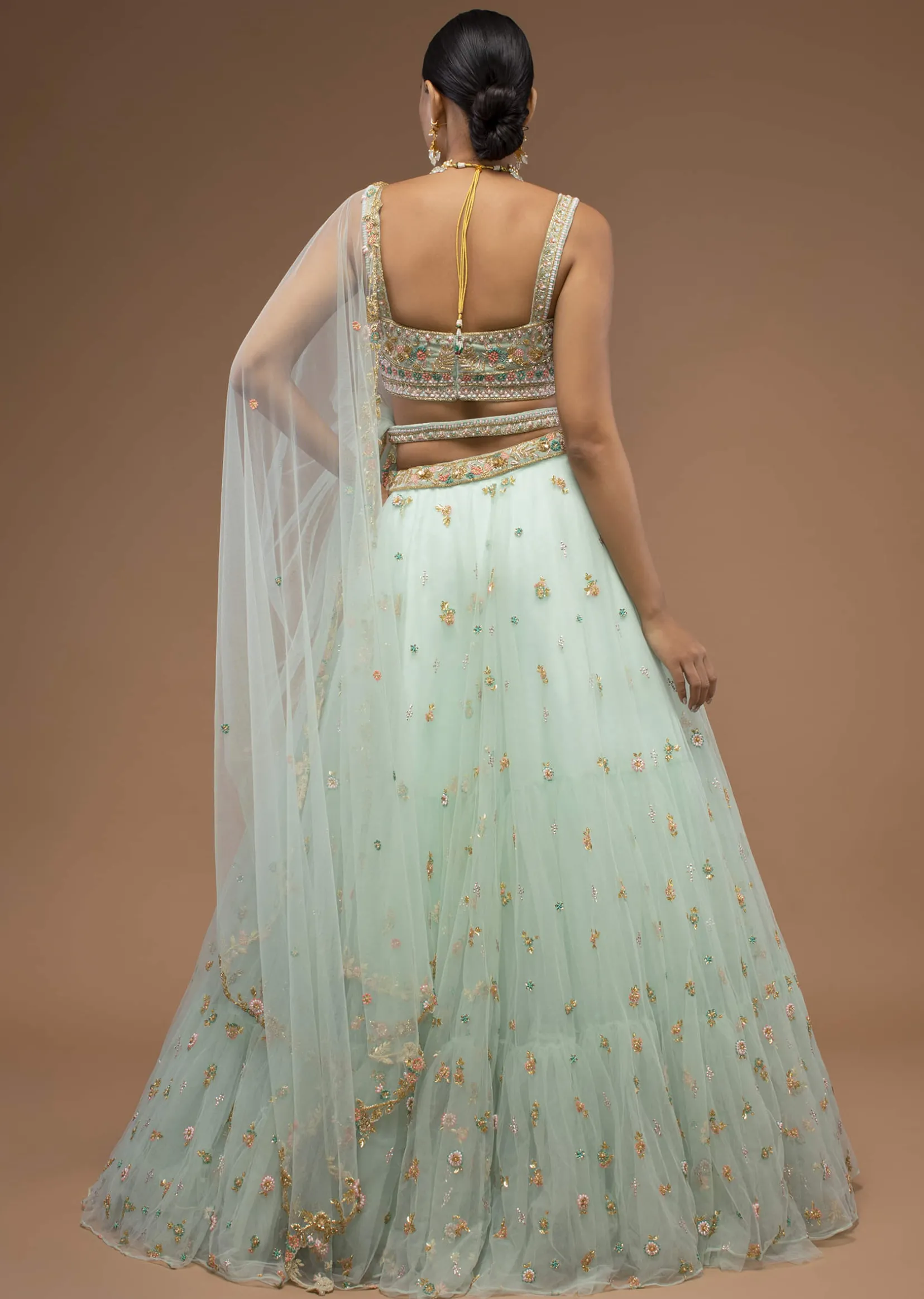 Mint Lehenga And A Crop Top Set Crafted In Net With Sequins And Resham Work