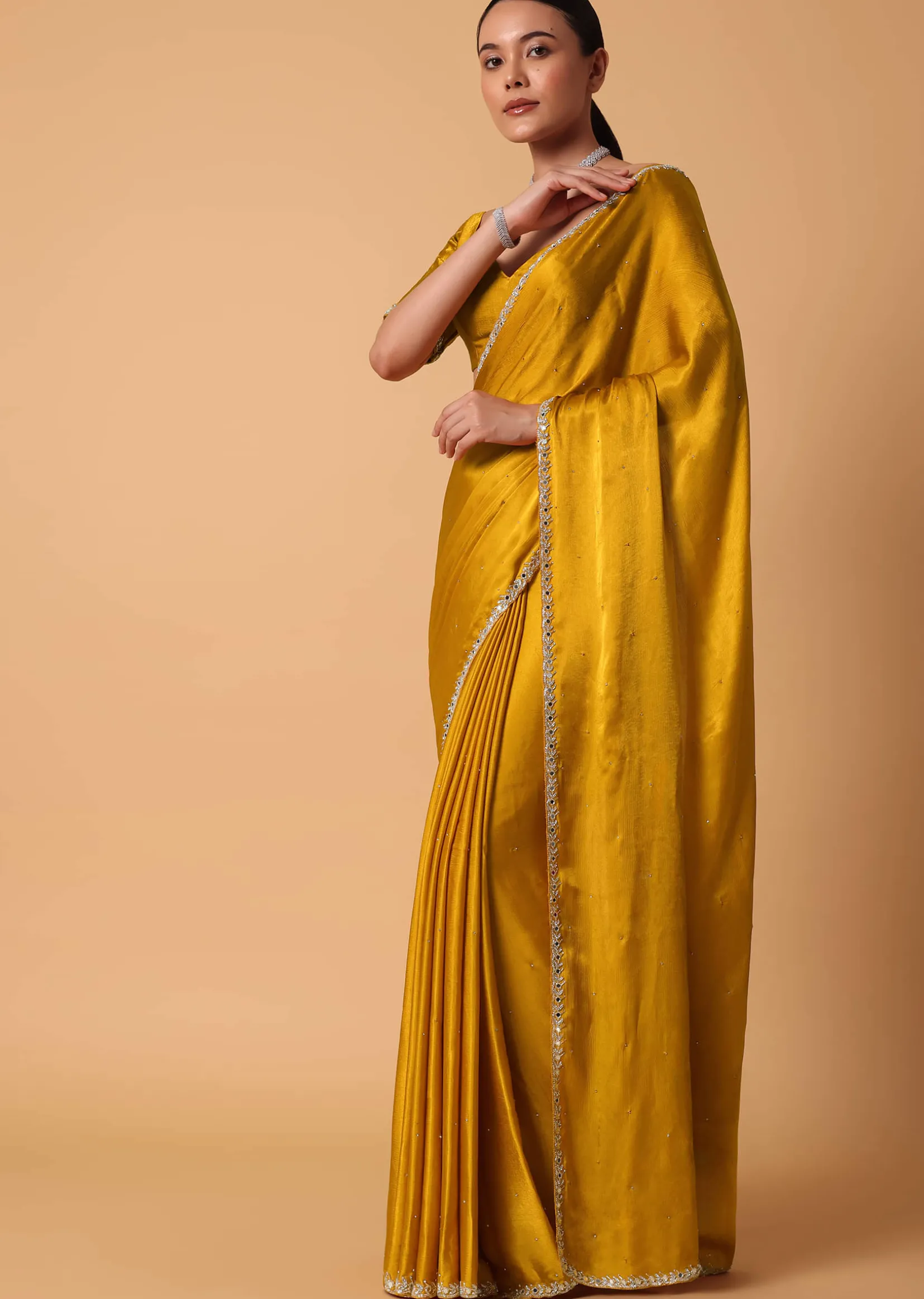 Mustard Satin Chinnon Saree With Mirror Detail Border And Unstitched Blouse Piece