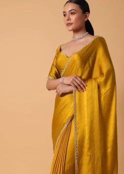 Mustard Satin Chinnon Saree With Mirror Detail Border And Unstitched Blouse Piece