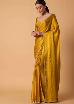 Mustard Satin Chinnon Saree With Mirror Detail Border And Unstitched Blouse Piece