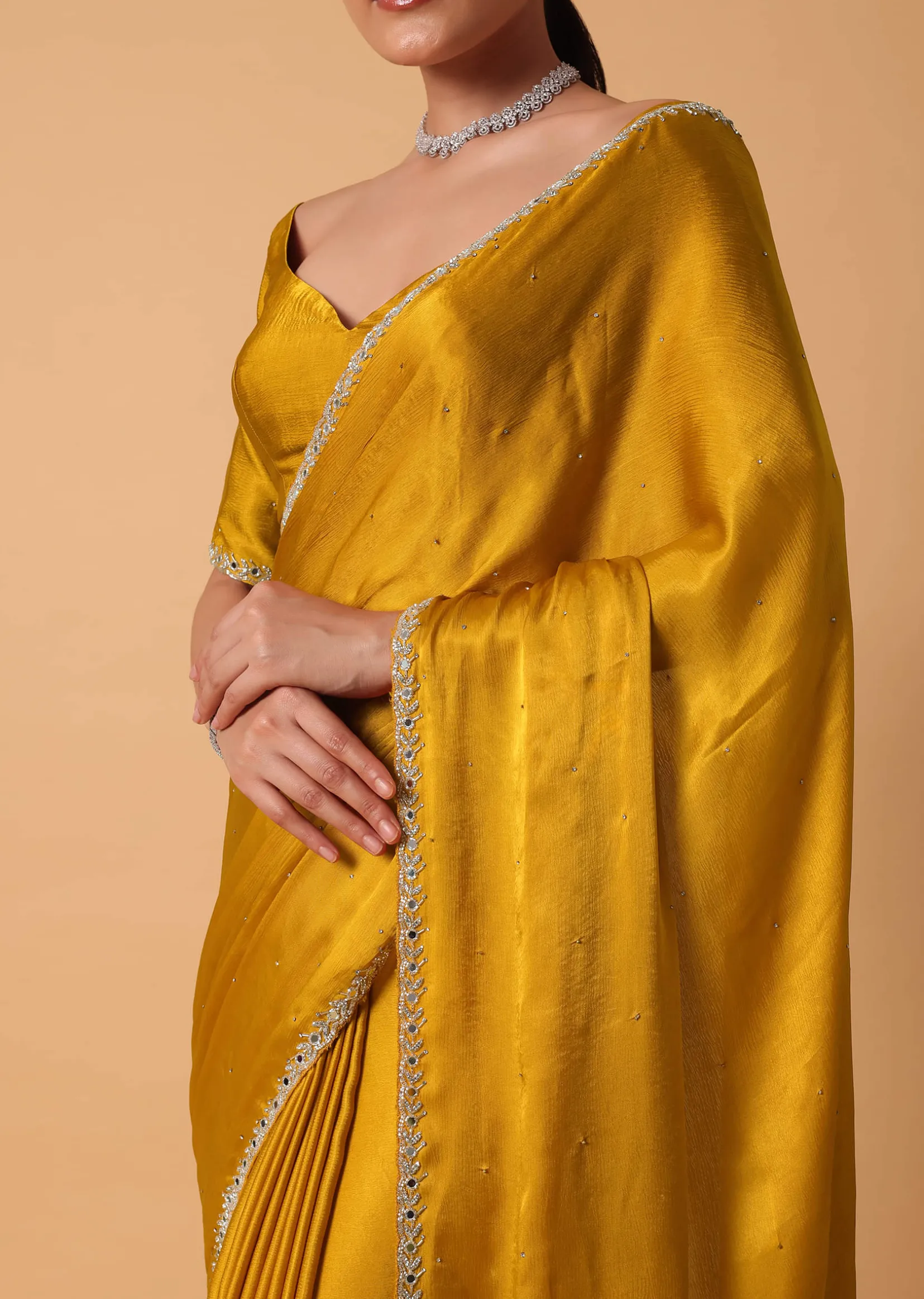 Mustard Satin Chinnon Saree With Mirror Detail Border And Unstitched Blouse Piece