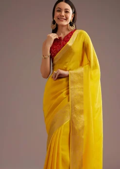 Mustard Yellow Crepe Silk Saree With Zari Border And Contrast Blouse