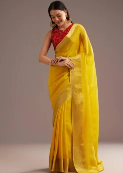 Mustard Yellow Crepe Silk Saree With Zari Border And Contrast Blouse