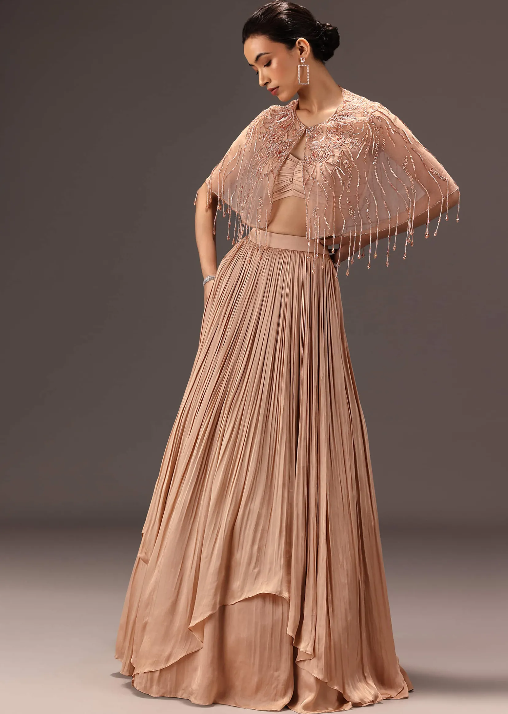 Nude Ruched Blouse With Cape And Layered Skirt
