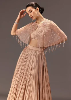 Nude Ruched Blouse With Cape And Layered Skirt