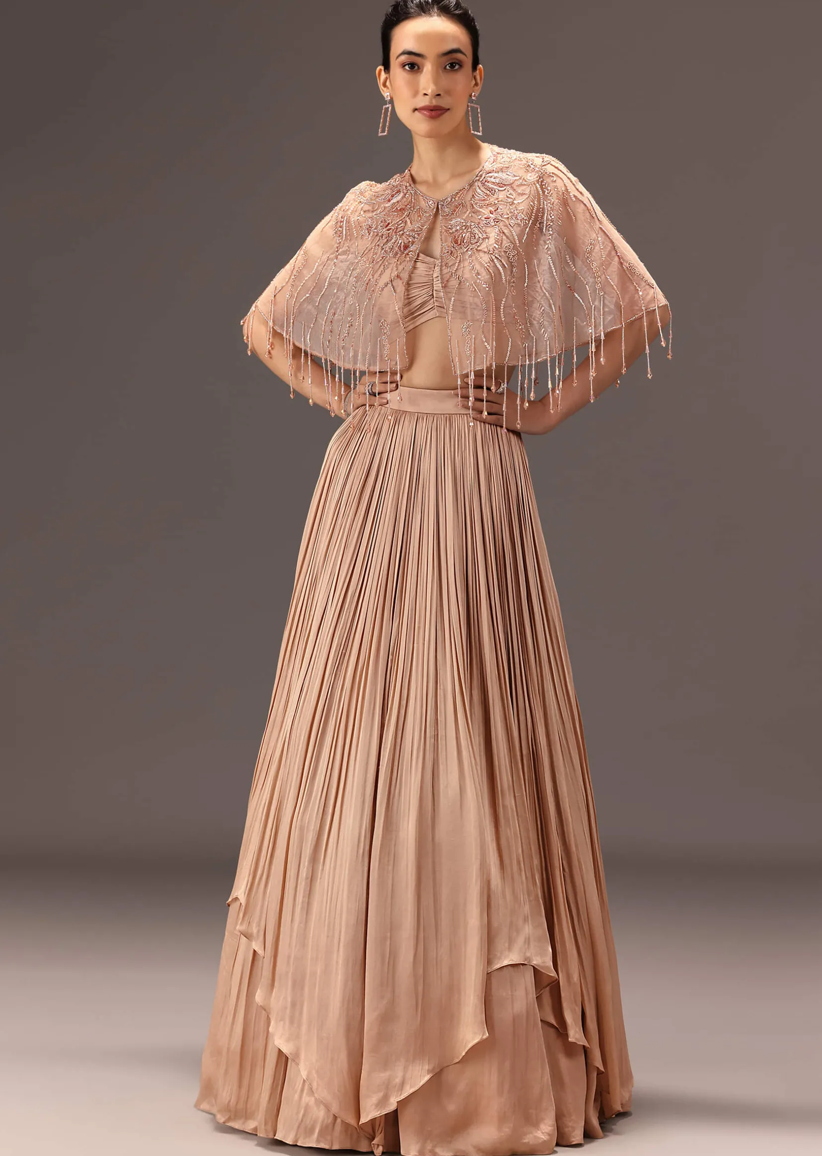 Nude Ruched Blouse With Cape And Layered Skirt