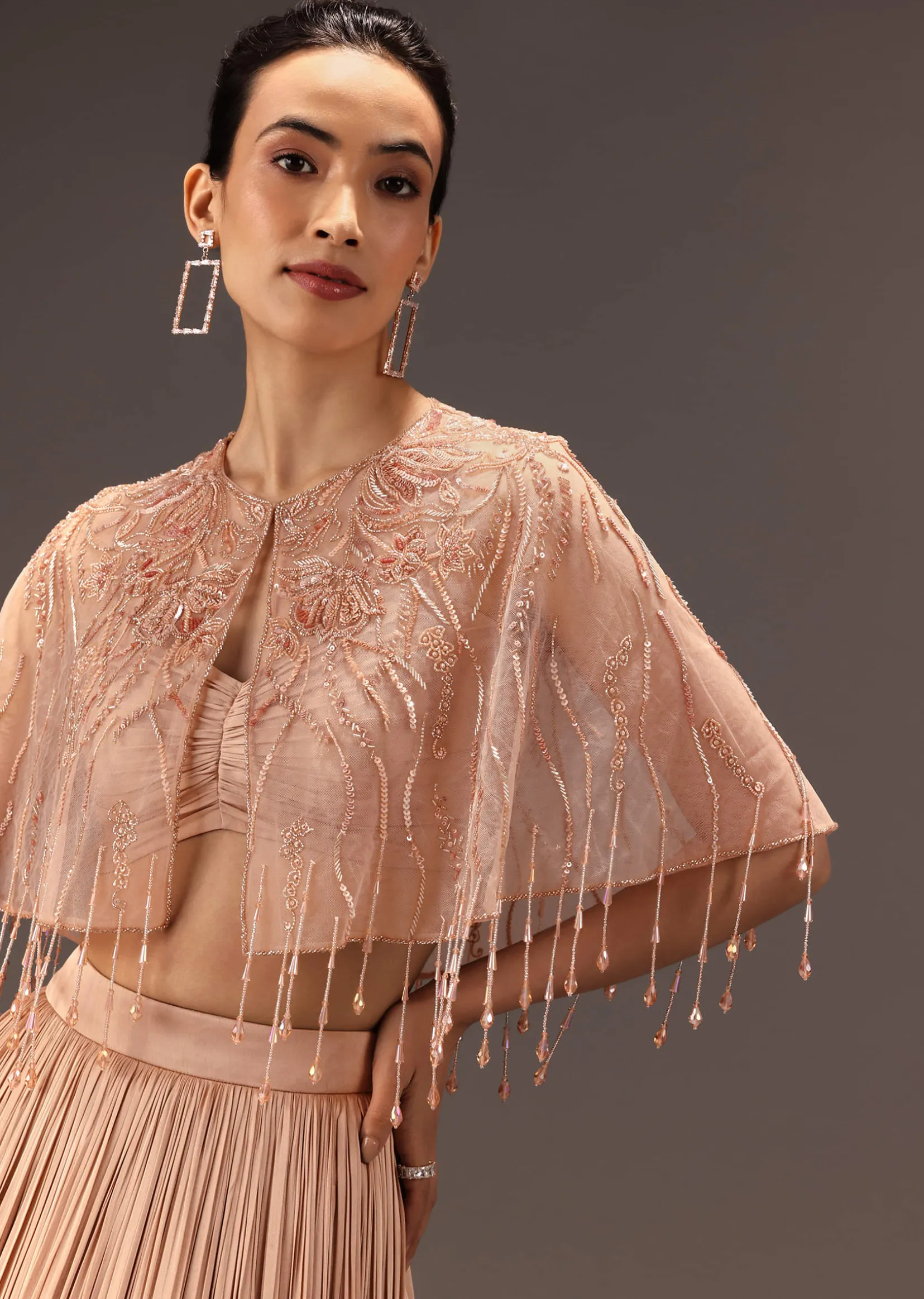 Nude Ruched Blouse With Cape And Layered Skirt