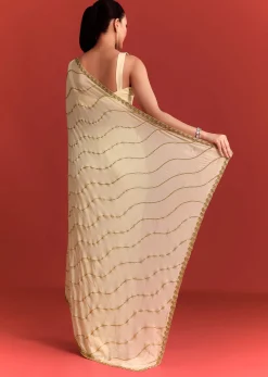 Off White Saree In Chinnon With Cutdana Embroidery