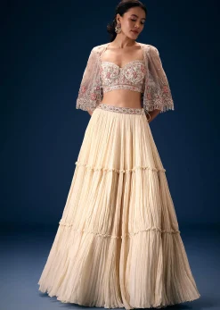 Off White Tiered Lehenga With Embroidered Corset Blouse And Embroidered Cape