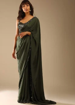 Olive Green Saree In Crepe With Sequins Ruffle On The Border, Sequins Blouse With Front Cut Out And Embellished Belt