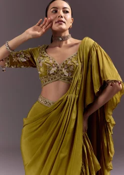 Olive Green Velvet Saree With Frilled Pallu And Heavy Embroidered Blouse