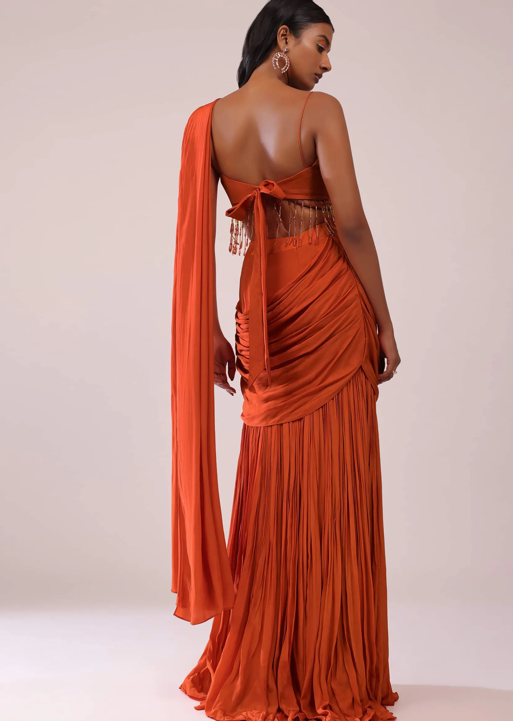 Orange Crepe Drape Saree And Blouse With Crystal Tassels All Over