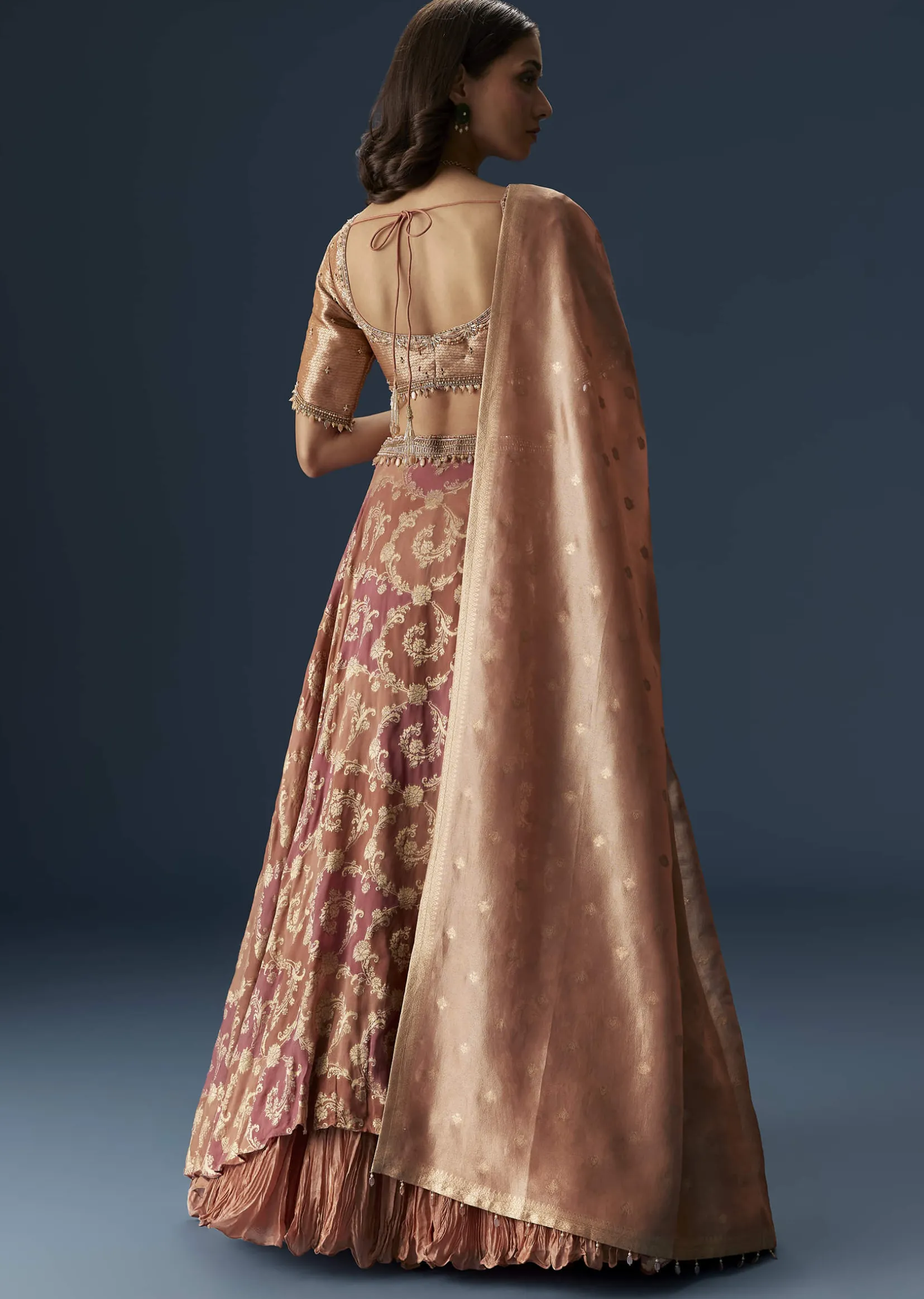 Orange Embroidered Blouse With Ruching Lehenga And Tassel Dupatta