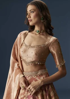 Orange Embroidered Blouse With Ruching Lehenga And Tassel Dupatta