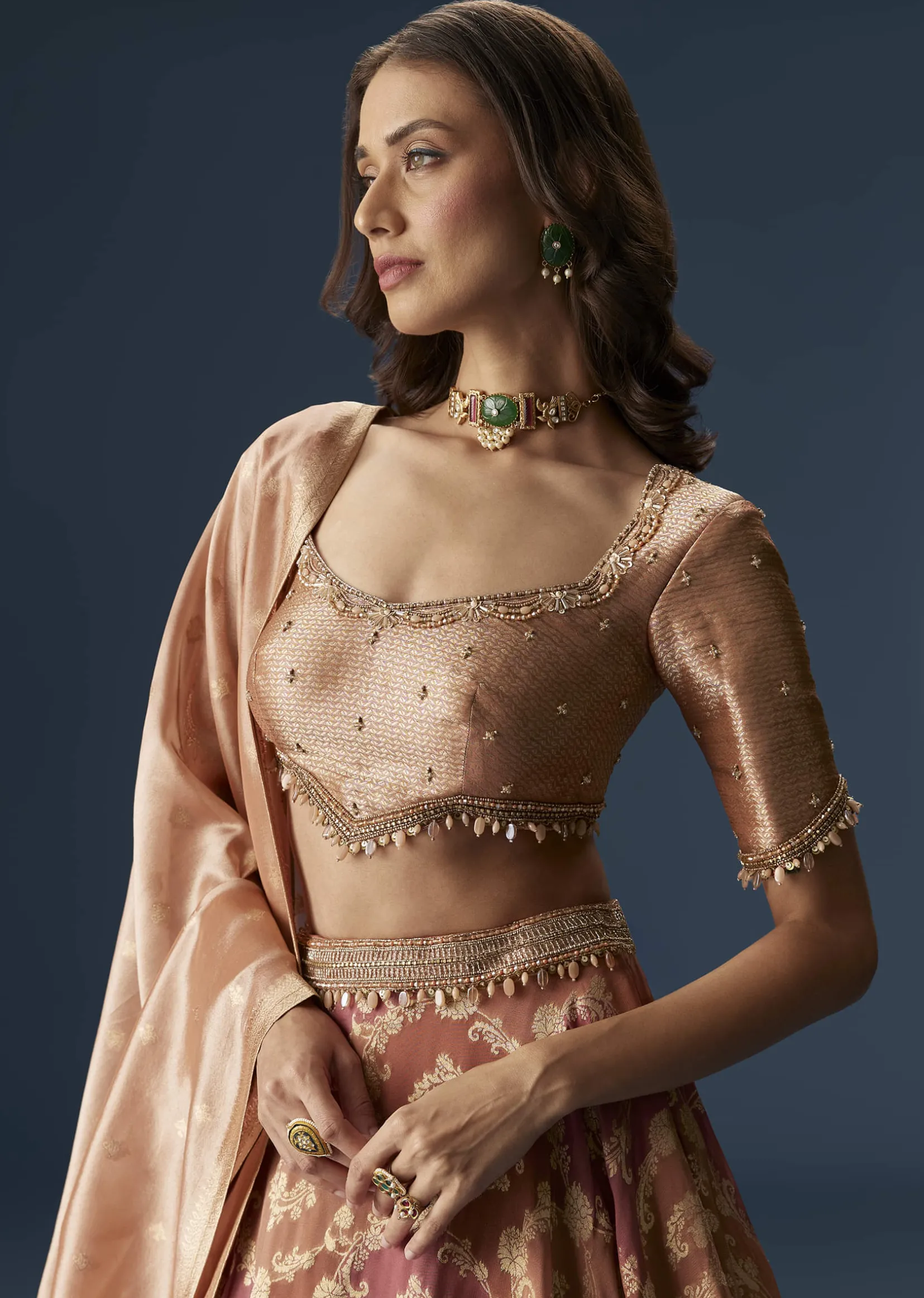Orange Embroidered Blouse With Ruching Lehenga And Tassel Dupatta
