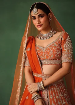 Orange Lehenga Set In Raw Silk With Hand Embroidered Motifs
