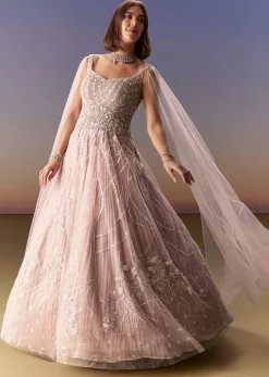 Pastel Pink Gown With Sheer Cape Drape And Heavy Embroidery