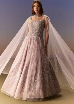 Pastel Pink Gown With Sheer Cape Drape And Heavy Embroidery