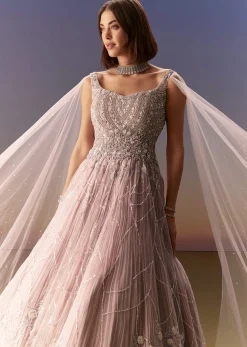 Pastel Pink Gown With Sheer Cape Drape And Heavy Embroidery